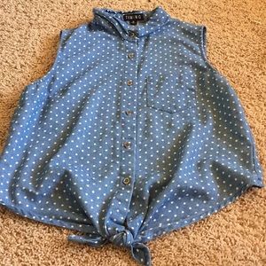A Blue Poka Dotted Shirt.